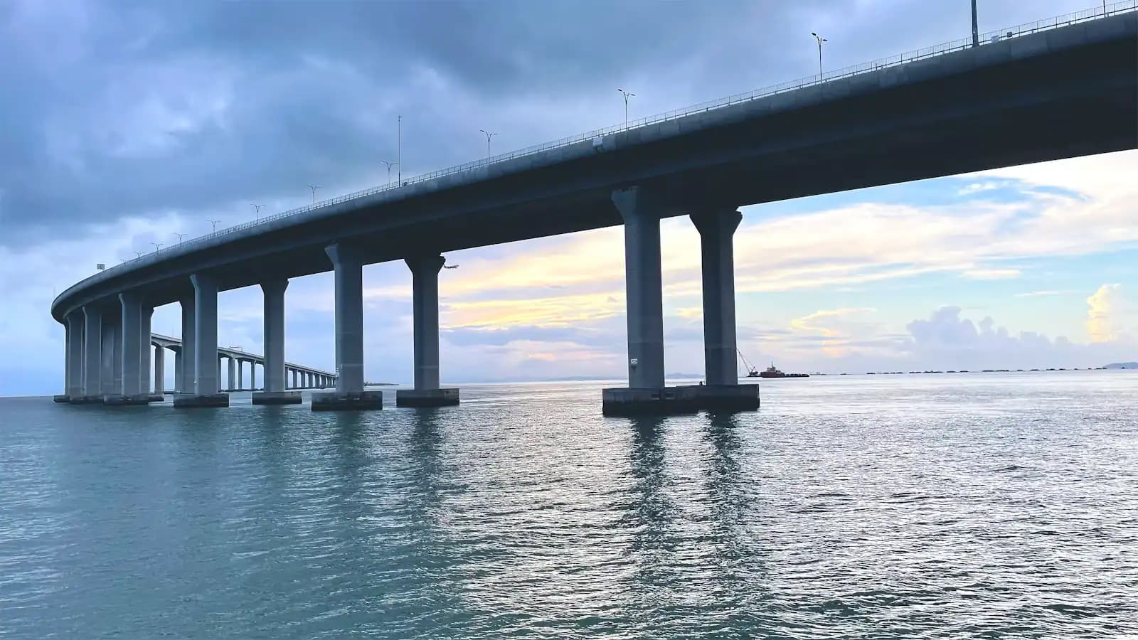 A long low road bridge crossing a wide expanse of open water
