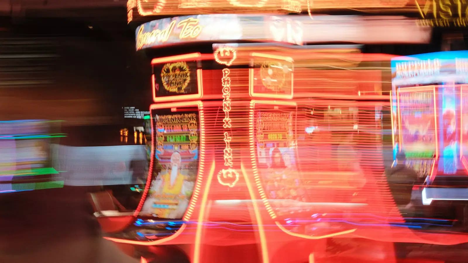 A motion-blurred casino floor with rows of lit slot machines